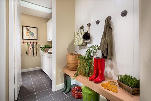 mudroom with free standing bench and hooks