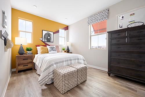 bedroom with yellow statement wall