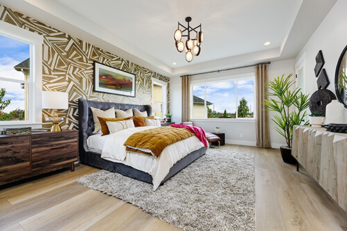 chandelier with circular lights in large bedroom