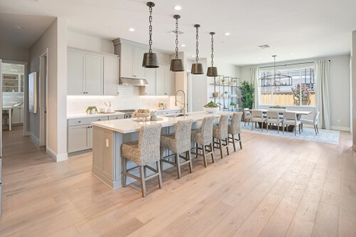 neutral kitchen with rattan chairs