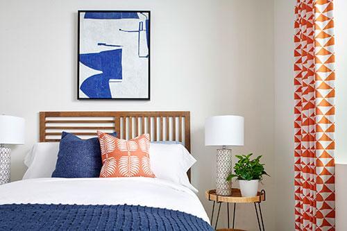 bedroom with blue and orange accents