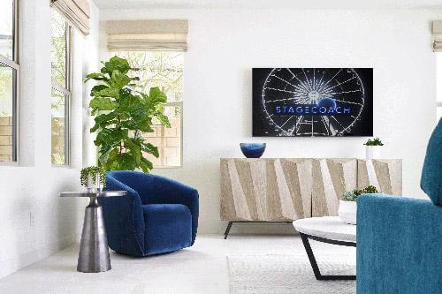 modern white living room with blue chair