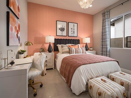 girls bedroom with pink and orange decor