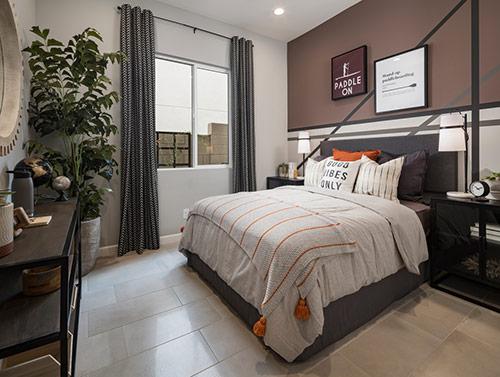 moody bedroom with gray bed frame
