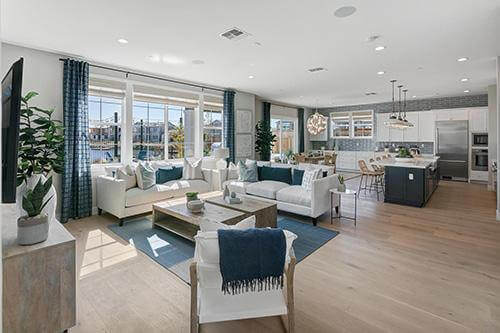 open concept living room with white and navy accents