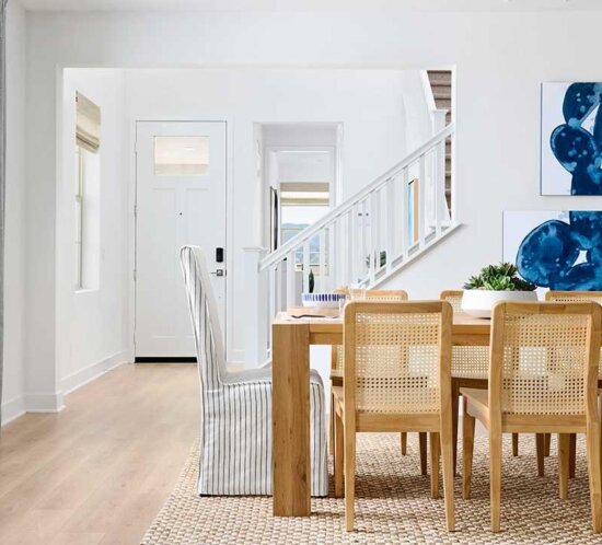 dining room with woven wood dining chairs