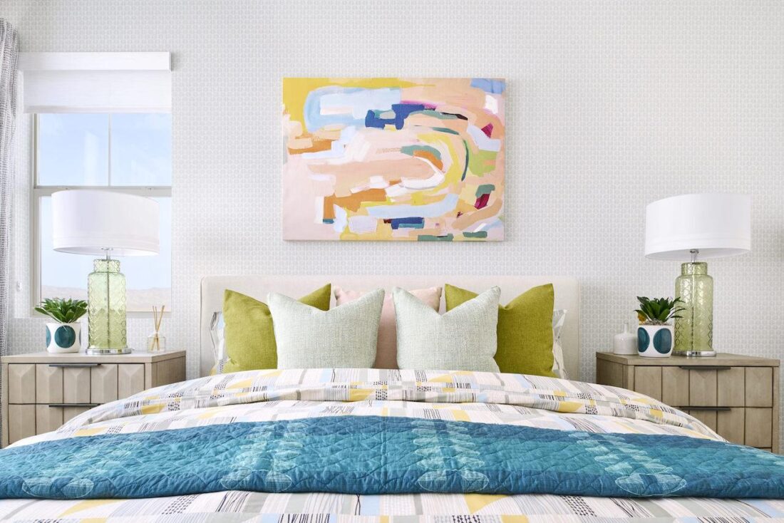 colorful primary bedroom with abstract art