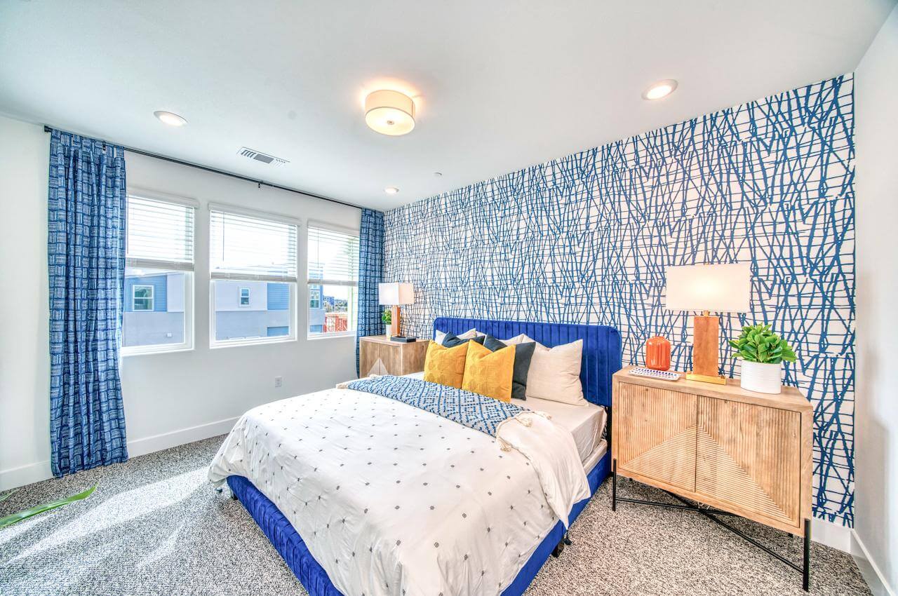 bedroom with blue accents and bed frame