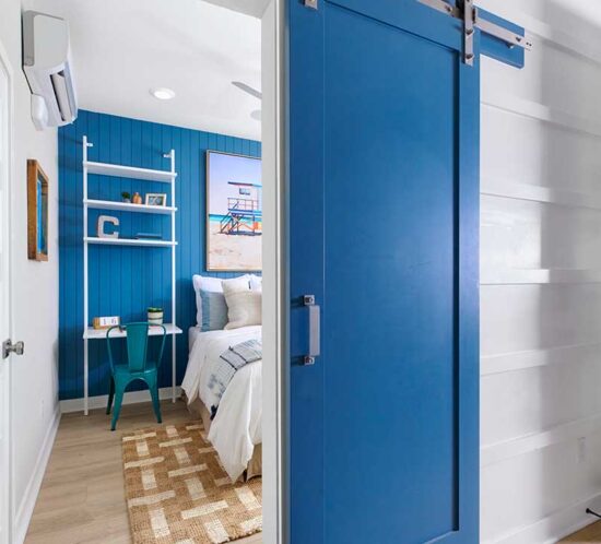 blue barn door to guest room