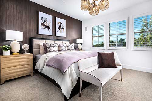 modern primary bedroom with purple accents
