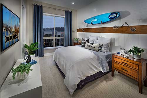 kids bedroom with surfboard on the wall