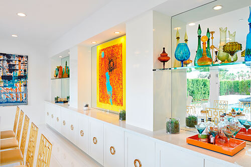 colorful shelving area with ceramic vases and sculptures