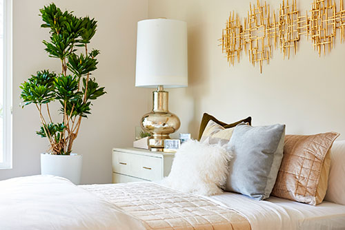 bedroom with gold ceramic lamp