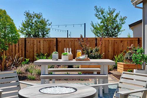 outdoor space with wooden accents and plants
