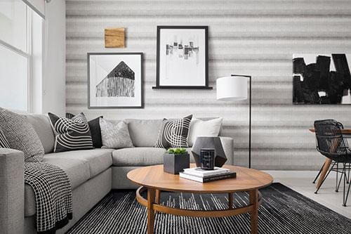gray living room with horizontal line wallpaper