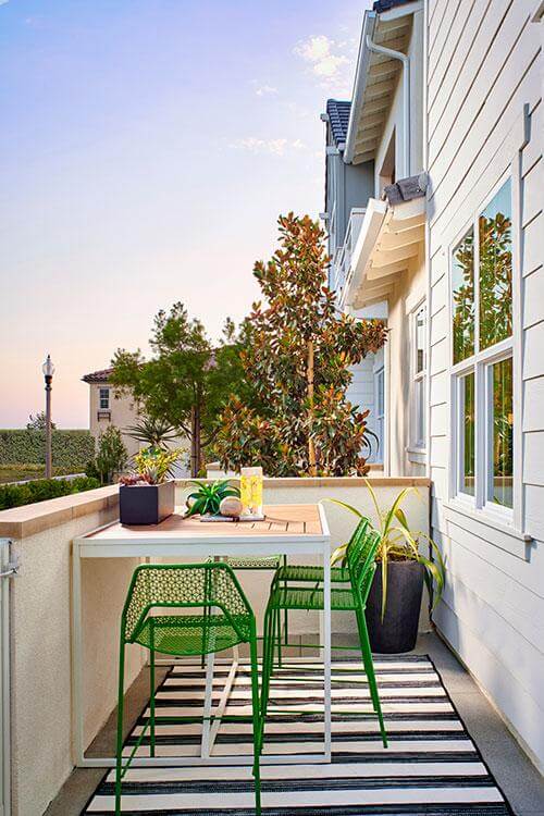 balcony with green iron chairs